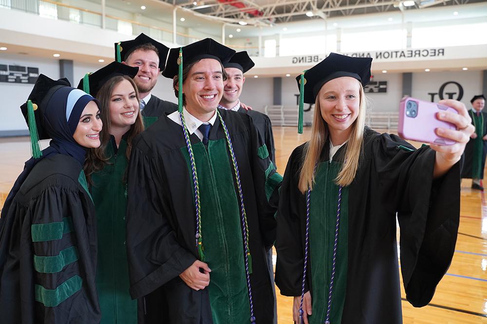 An image of students celebrating at commencement